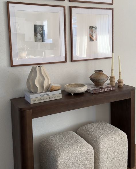 Looking to elevate your hallway or entryway? 🤎⁠ .⁠ Meet the Contour Console Table in Walnut—your go-to for a chic, modern touch. Its minimalist design seamlessly blends with any decor, while offering a stylish platform to showcase your favorite decor. Create a cozy, curated look and elevate your home’s vibe. Click the link in our bio to explore our full range of solid wood console tables!⁠ ⁠ #plankandbeam #console #minimalistaesthetic #quietluxury #hallwaydecor #homedetails #cozylivingroom Entryway Table Apartment, How To Style Hallways, Bench Entrance Ideas, Walnut Wood Decor, Living Room Decor Townhouse, Modern House Decor Ideas Apartments, Home Decor Ideas Dark Wood, Modern Minimalist Entryway, Entryway Into Living Room