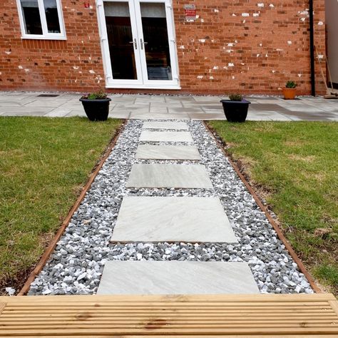 Natural sandstone stepping stones with speckled granite gravel creates a stand out feature for less than standard paving!   We used decking boards to create a sturdy, discrete border between the gravel and the grass Paving With Gravel In Between, Stepping Stone Path, Sea Villa, Stepping Stone Paths, Decking Boards, Gravel Path, Patio Garden Design, Stone Path, Deck Boards