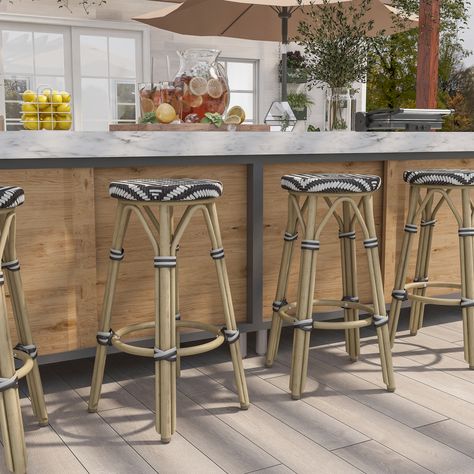 Tropical fun finds itself on this set of barstools. The natural tone frames and playful pattern of these seats transform your patio into a hotspot for friends. Outside Bar Stools, Outdoor Stool, Kelly Clarkson Home, Patio Bar Stools, Bar Patio, Bar Height Stools, Outdoor Stools, Outdoor Bar Stools, Brown And Beige