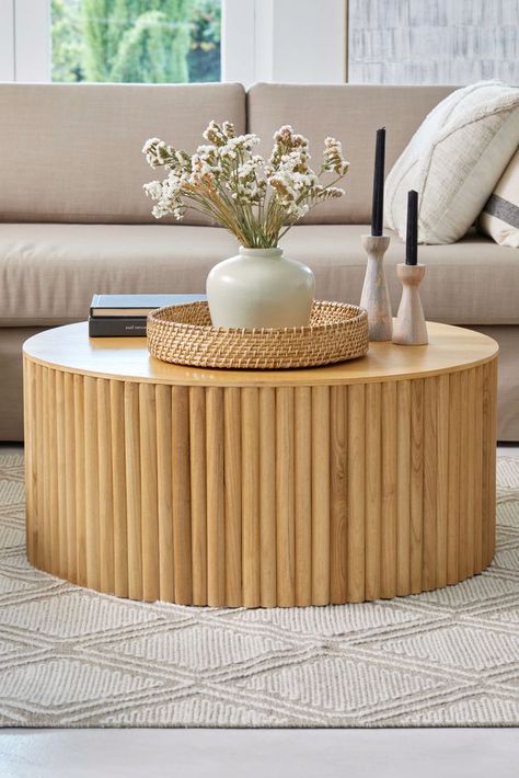 The Luca coffee table is a modernist approach to living. Made with half-moon wood panels surrounding the base, this round table offers a balance between stylised elegance and understated earthiness. Round Bamboo Coffee Table, Circular Coffee Table Styling, Circle Coffee Table Decor, Circle Coffee Table, Coffee Tables Round, Best Coffee Table, Tropical Bedroom Decor, Center Table Decor, White Round Coffee Table