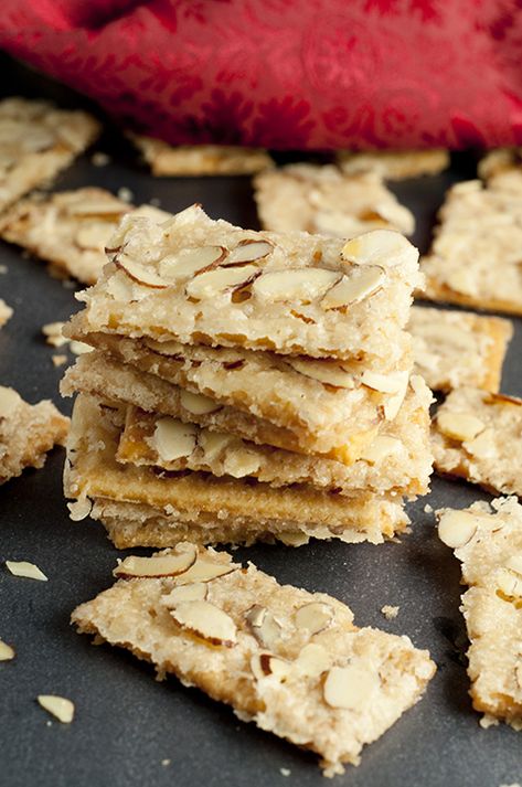 Almond Club Cracker Toffee   Prep time 10 mins Cook time 7 mins Total time 17 mins   Almond Club Cracker Toffee recipe is salty crackers coated in sweet toffee sauce & slathered with almonds. This will be your new favorite easy holiday treat! Author: Ashley Recipe type: Dessert Cuisine: American Serves: 30 crackers Ingredients 1 stick butter (1/2 cup) ½ cup sugar 1 tsp vanilla 1 sleeve Club crackers 1 cup slivered or sliced almonds Instructions Arrange crackers holes side up on cookie sheet wit Snacks With Club Crackers, Sweet Almond Crackers, Christmas Cracker Toffee With Club Crackers, Recipes With Club Crackers, Club Cracker Cookies, Toffee Crackers Club, Club Cracker Dessert, Club Cracker Bars, Sweet Crackers Recipe