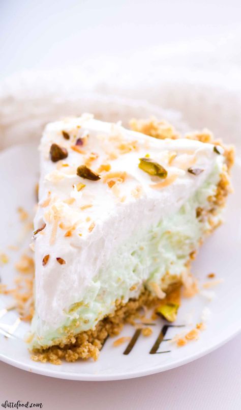 This homemade no bake pistachio pudding cream pie is layers of graham cracker crust, pistachio pudding cream, and whipped cream! Plus, this pistachio cream pie is filled with sweet pineapple and coconut! This easy no bake dessert would make the perfect Easter dessert, or with it’s pretty color, even a St. Patrick’s Day dessert! Pudding Cream Pie, Pistachio Pie, Pistachio Dessert, Homemade Graham Cracker Crust, Pudding Ice Cream, Homemade Graham Crackers, Pistachio Cream, Pistachio Pudding, Baking Desserts