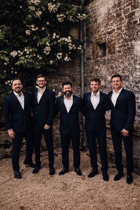 Groom with groomsmen standing together in matching suits without their bow ties Groomsman Speech, Groom With Groomsmen, Matching Suits, Wedding Party Groomsmen, Silent Disco, Grooms Party, Mens Wedding Attire, Groomsmen Outfits, Groomsmen Bowtie