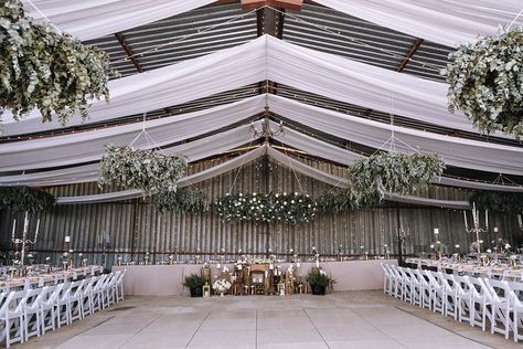 Hangar Wedding Decor, Metal Shop Wedding Reception, Boho Wedding Ceiling Decor, Machine Shed Wedding Reception, Machine Shed Wedding, Pole Barn Wedding, Wedding Plants Decor, Influencer Dinner, Shop Wedding Reception