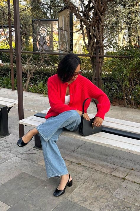 @irinarabary is giving us a pop of red in spring wearing the Sézane Emile cardigan. Her outfit is completed by a white tank, blue jeans, and black ballet flats. Such a cute and comfortable yet elevated outfit for spring. We love seeing you all style our Sézane pieces! Red Shoes Jeans Outfit, Jeans Cardigan Outfit, Pop Of Colour Outfit, Pop Of Red Outfit, Red Cardigan Outfit, French Wardrobe Basics, Red Ballet Flats, French Wardrobe, Flats Outfit