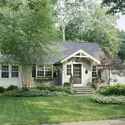 Cottage Facelift Cottage Facelift Sliding the front entrance toward the center of this home and bumping it out helps balance out the structure and gives it more depth. Wide stone steps and a cross gable clearly mark off the entryway and graciously invite guests inside. Replacing large bushes with lower ground coverings complements the home's proportions instead of overpowering them. The addition of even these small details adds architectural interest to the small home. Curb Appeal Porch, Front Porch Addition, Porch Stairs, Entry Porch, Porch Addition, Ranch Remodel, Porch Roof, Home Exterior Makeover, Exterior Makeover