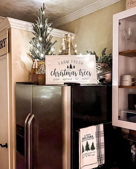 Amber Vestal on Instagram: “I love decorating above our fridge! 🎄✨ it adds such a festive glow at night. Those a $16 Walmart tree and some twinkle lights up there and…” Top Refrigerator Decor Ideas, Above Fridge Decor, Top Of Refrigerator Decor Ideas, Top Of Fridge Decor Ideas, Top Of Fridge Decor, Top Of Refrigerator Decor, Fridge Top Decor Ideas, Fridge Top Decor, Top Of Fridge