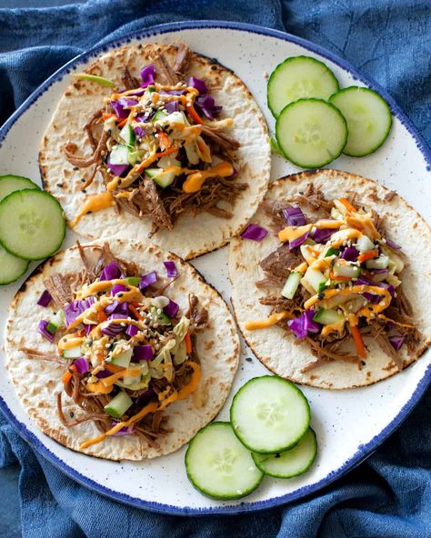 Korean Tacos are tender beef tacos made in the slow cooker or instant pot. Top with a spicy Asian slaw and sriracha mayo! #korean #beef #tacos #recipe Korean Tacos With Asian Slaw, Korean Bbq Tacos, Asian Tacos, Shredded Pork Tacos, Korean Beef Tacos, Korean Tacos, Slow Cooker Korean Beef, Slow Cooker Asian, Korean Pork