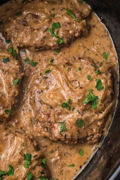 This Slow Cooker Cube Steak is the ultimate weekday comfort meal! The cube steak is seared and then slow-cooked with onions and garlic, creating a rich, creamy, and flavorful savory gravy with perfectly tender meat. Serve these smothered steaks with mashed potatoes and green beans for a balanced meal that will not leave you hungry! Crockpot Cubed Steak, Tender Cube Steak, Slow Cooker Cube Steak, Cube Steak Crock Pot Recipes, Marinated Steak Kabobs, Mashed Potatoes And Green Beans, Pot Roast Sandwiches, Smothered Steak, Cube Steak And Gravy