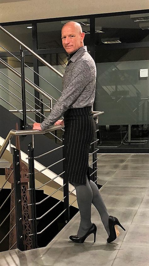 Black pin striped skirt, gray thermo tights, long sleeve Polo, and black Heels.   Man in Skirt, men in skirts and heels, men in skirts, men in skirts and heels Pantyhose Outfit Men, Man In Skirt, Men In Dresses, Skirts Men, Mark Bryan, Galaxy Brain, Men In Skirts, Trans Fashion, Boys Wearing Skirts