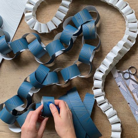 Paper chains are a wonderful way to use up left over wallpaper scraps or off cust. I have made these chains out of single designs but they look beautiful when made of mixed patterns which means even the tiniest strip of paper doesn’t go to waste #sustainablechristmas #diychristmasdecorations #christmascrafting #makeyourownchristmasdecorations #papercraft #paperchains #diypaperchains #makeyourownpaperchains Paper Craft Garland, Paper Chain Christmas Garland, Paperchain Christmas Decoration, Paper Ring Garland Christmas, Paper Chains Christmas Garland, How To Make Paper Chains, Christmas Paper Chains Garland, Paper Chain Garland Christmas, Paperchain Christmas