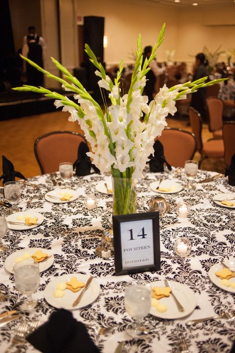 Cebolla Fine Flowers // Dallas Wedding // Lakewood Country Club // White Gladiolas // Gladiola Centerpiece Greenery Tall Centerpiece Wedding, Gladiola Centerpiece, Wedding Table Deco, Eiffel Tower Centerpiece, Tall Flower Arrangements, Farmers Market Flowers, Greenery Wedding Bouquet, Wedding Decorations On A Budget, Gladioli