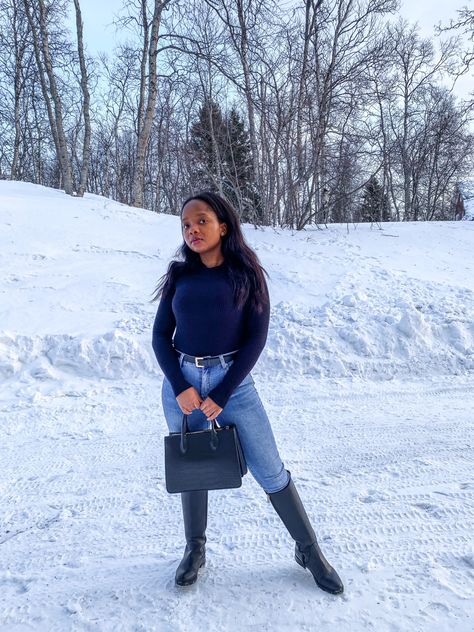 Black high neck knit top with blue skinny jeans and knee high boots. #denim #boots #workwear #handbag #tommyhilfiger #winteroutfits | Classy Black Girl Outfit Tommy Hilfiger Boots Outfit, Ski Trip Essentials, Tommy Hilfiger Boots, Handbag Essentials, Denim Boots, Boots Outfit, Winter Looks, Paloma, High Boots