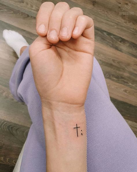 40+ Stylish Cross Tattoo Designs For Men And Women Cross Wrist Tattoos For Women, Semicolon Wrist Tattoo, Tiny Cross Tattoo, Cross Tattoo On Wrist, Wrist Tattoos Girls, Small Cross Tattoos, Simple Cross Tattoo, Tato Tradisional, Side Wrist Tattoos