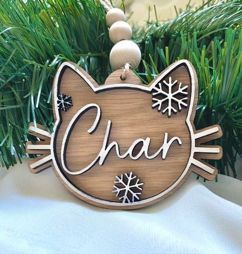 Pet cat ornament made by TheTimberCanvas.  With or without snowflakes.  Wooden backer with wooden or acrylic top.   Farmhouse classic style.  Order yours today and get it before it's time to decorate this Christmas season! Christmas Orniments, Glowforge Projects, Cat Wood, Decorative Balls, Cat Christmas Ornaments, White Ornaments, Wood Christmas Ornaments, Wooden Ornament, Wood Christmas