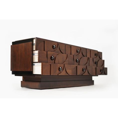 This striking Brutalist-style dresser showcases a masterful execution in walnut, highlighted by unique ORB accent corners and hardware. The piece features nine spacious drawers, offering ample storage while enhancing its bold aesthetic. Meticulously restored to its original splendor, this dresser combines robust design with functional elegance, making it a standout addition to any interior. Brutalist Furniture Mid Century, Brutalist Cabinet, Luxury Brutalist Metal Jewelry, Brutalist Bronze Brass Jewelry, Luxury Gold Brutalist Jewelry, Walnut Dresser, Lexington Furniture, Robust Design, Dressers And Chests