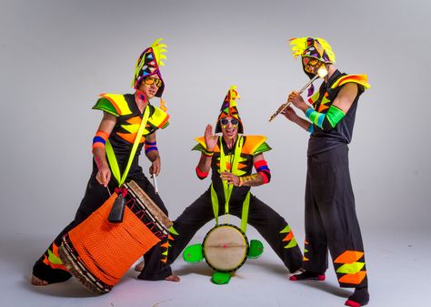 These are the drummers from 'Firefly' - African drum and dance ensemble in wild fluro costumes Drummer Costume, Year Concert, School Assembly, African Drum, Dance Classes, Drummers, Dance Class, Firefly, Lion King