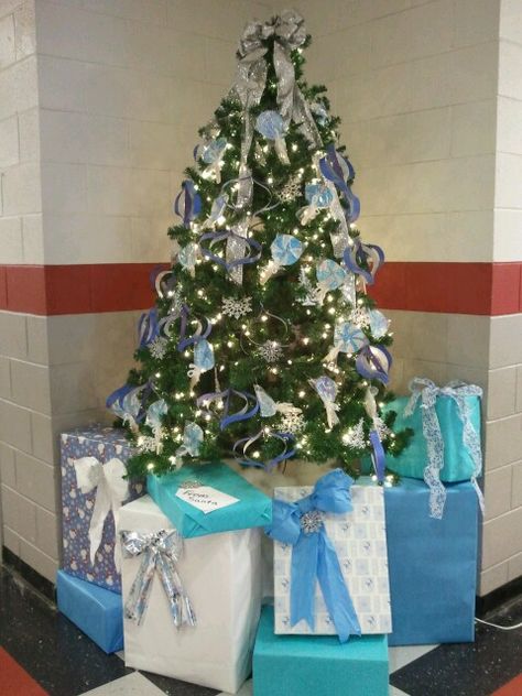 Short Christmas tree at school. Put it on a table to make it look taller then hide the bottom with large wrapped boxes. The one says "from Santa", kids love it. How To Make A Short Christmas Tree Look Taller, Short Christmas Tree, Lots Of Presents Under The Tree, Classroom Doors, From Santa, Classroom Door, At School, Holiday Decorations, Fourth Of July