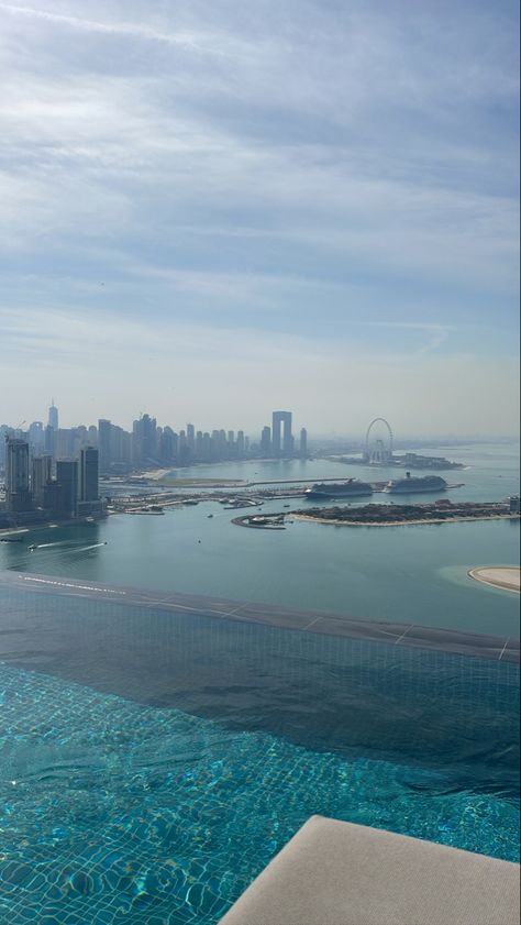 Pool views dubai view ferris wheel buildings dubai view views pretty blue light blue pool view dubai pool dubai sea beach views beach life ocean blue Sky Pool Dubai, Light Blue Pool, Dubai Pool, Barbie Cars, Dubai View, Sky Pool, Aurora Sky, Los Angeles Airport, Dubai Beach