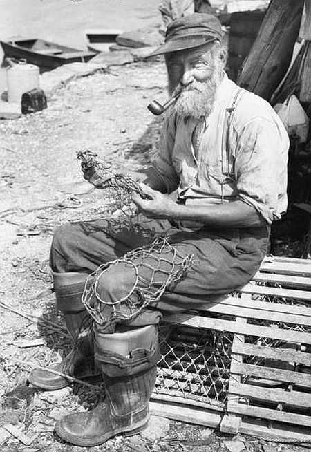 Portrait of a fisherman sitting on a lobster trap. Lobster Trap, Old Fisherman, Sea Captain, Fishing Nets, Fishing Net, Foto Art, Vintage Fishing, Fishing Gear, Vintage Photographs