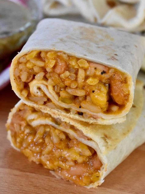 Cheesy Bean and Rice Burritos are so simple to make and come together in just minutes! With just a handful of ingredients, you can have delicious and satisfying burritos! Cheesy Bean And Rice Burrito, Rice Burrito Recipe, Bean And Rice Burrito, Easy Burritos, Rice Burrito, Bean And Rice, Beans And Cheese, Taco Spaghetti, Cheesy Rice