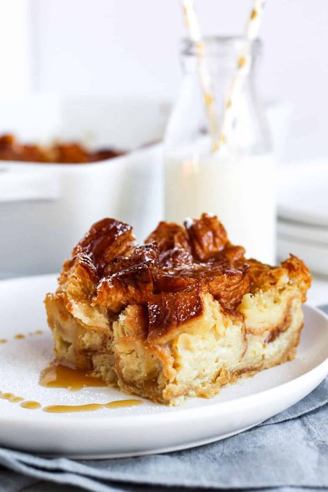 Slice of croissant bread pudding on a white plate drizzled with a vanilla sauce. Espresso Bread Pudding, Bread Pudding With Croissants, Croissant Bread Pudding, Croissant Bread, Homemade Croissants, Sourdough Recipe, Pecan Pies, Bread Puddings, Seasonal Desserts