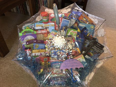 This is an auction item I made for a Mary Poppins themed fundraiser. It is a child’s umbrella full of rainy day activities for children including science kits, slime kit, popcorn and a movie, coloring and activity books, arts and crafts, clay with tools, games, and more. It went for $75. Rainy Day Basket Auction, Rainy Day Auction Basket Ideas, Rainy Day Raffle Basket, Rainy Day Basket, Rainy Day Gift Basket Ideas, School Auction Baskets, Fundraiser Baskets, Art Auction Projects, Auction Basket