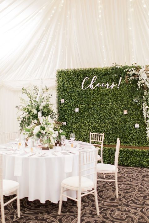 ###Reception Backdrop    Hosting a tented reception? Bring the outdoors inside with a large greenery wall installed on one end of the tent. You could position it behind your sweetheart table or the head table; it’s also makes a great backdrop for the toasts—invite speech-givers to stand in front of the wall as they offer their toasts (the photos are guaranteed to be fabulous!). Boxwood Hedge Wall, Boxwood Backdrop, Burlap Wedding Decorations, Wedding Flower Trends, Reception Backdrop, Wedding Reception Backdrop, Tent Reception, Wedding Wall, Burlap Wedding