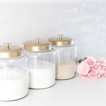 Quick and easy DIY project! Here's a little hack to get these beautiful gold lidded glass kitchen canisters. Also sharing other canisters I love! Kitchen Counter Canister Ideas, Kitchen Canisters On Counter Display, Painting Glass Canisters, Spray Painting Glass, Glass Kitchen Canisters, Apple Kitchen Decor, Coin Café, Kitchen Accessories Storage, Diy Gold