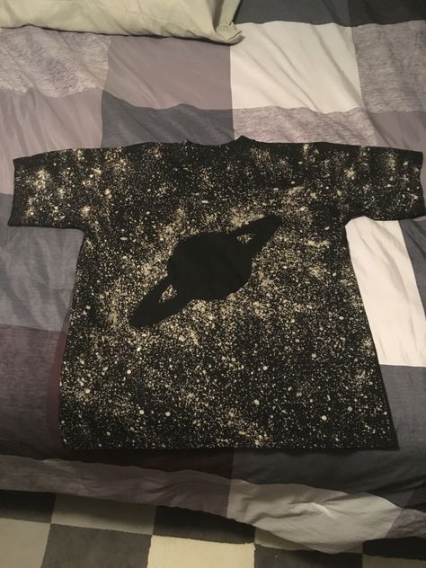 Made by placing wood cutout on shirt, dabbing spots of pure bleach with a marker tip to create bright stars, then spraying with 50/50 bleach and water. DIY shirt design. Space Bleach Shirt, Bleach Tee Shirt Ideas, Black Bleached Shirt, Diy Shirt Design, Bleach Designs, Bleach Shirt Diy, Bleaching Clothes, Tie Dye Shirts Patterns, Painted Clothes Diy