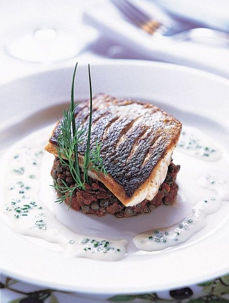 Looking for an impressive but easy main course? Then serve guests these fillets of sea bass on provençal lentils with a creamy chive sauce. Such an impressive dish that isn't too difficult to make. Chive Sauce, Sea Bass Recipes, Hp Sauce, Fine Dining Recipes, Delicious Magazine, Lentil Recipes, Sea Bass, Fish Dishes, Food Presentation