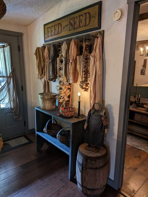 Colonial Decorating Ideas, Colonial Foyer, Primitive Bedding Bathroom, Primitive Peg Rack Decor, Dark Home Aesthetic, Colonial Primitive Homes, Colonial Primitive Decor, Primitive Shelves With Hooks, Primitive Livingroom Furniture