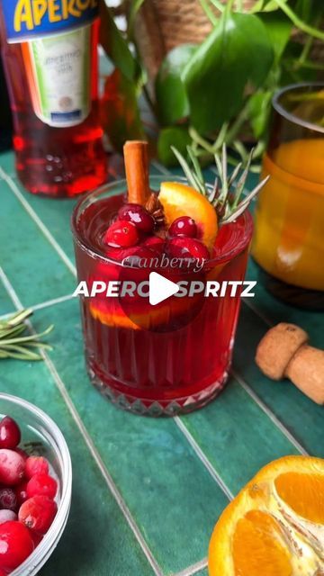 Sarah Bond on Instagram: "Cranberry Aperol Sptriz! Drop in those spiced cranberry ice cubes, top with Aperol and bubbly, and watch the magic happen. It’s the ultimate holiday sipper!  Comment 👉 "spritz" and I'll send you the recipe!  (Tag a friend who you're going to make this with! )  https://www.liveeatlearn.com/cranberry-aperol-spritz/  #aperolspritz #aperol #wintercocktail #fallcocktail" Cranberry Aperol Spritz Recipe, Aperol Spritz Ice Cubes, Aperol Ice Cubes, Sprits Cocktail, Cranberry Aperol Spritz, Cranberry Ice Cubes, Cranberry Ice, Aperol Spritz Recipe, Winter Cocktails