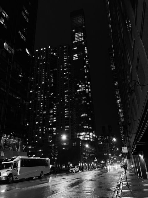 this is a picture of downtown Chicago at night. The picture is looking up at tall buildings. It is in black and white with lots of dark contrast and some cars on the street driving by City Night Life Aesthetic, Skyscrapers Aesthetic, Downtown Chicago At Night, Chicago City Night, Night City Life, Buildings Skyscrapers, Aesthetic Buildings, Night Life Aesthetic, Stargirl Interlude