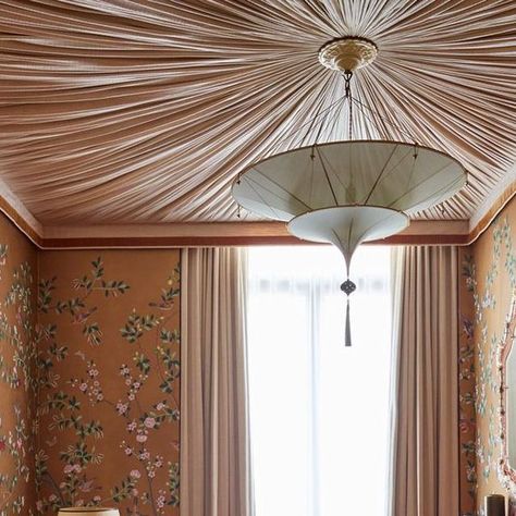 Studio Ashby on Instagram: "Enveloped in @degournay chinoiserie wallpaper and a pleated fabric tented ceiling: a splash of decadence in a bright, modern home.⁠⁠ ⁠ ⁠ Read more about our seaside project in our new book, Soul, Art, Home. Pre-order now through the link in our bio.⁠ ⁠ 📸 @philipdurrant⁠ Styling @oliviagregorystylist⁠ ⁠ @pilbrowandpartners⁠ @formationarchitects⁠ @sizegrouplondon⁠ ⁠ #StudioAshby #interiordesign #interiordecor #interiors" Tented Ceiling Bedroom, Fabric Draped Walls Bedroom, Cover Ceiling Ideas, Tapestry On The Celling, Tented Bedroom Ceiling, Swagged Fabric Ceiling, Upholstered Ceiling, Tapestry’s On Ceiling, Fabric Ceiling Ideas