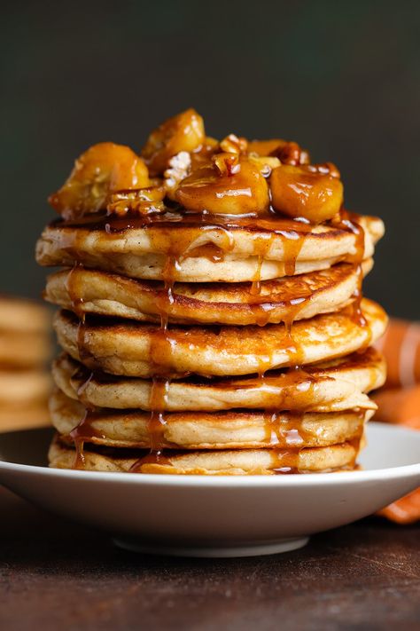 These Banana Foster Pancakes are extra fluffy, gluten-free, and topped with caramelized bananas with rum and pecans. The batter is made with buttermilk which makes it light, soft, and extra fluffy. Serve them for breakfast, brunch, or even dessert! Christmas Coconut Margarita, Banana Foster Pancakes, Pecan Pancakes, Banana Foster, Greek Yogurt Pancakes, Banana Buttermilk, Coconut Margarita, Caramelized Bananas, Bananas Foster