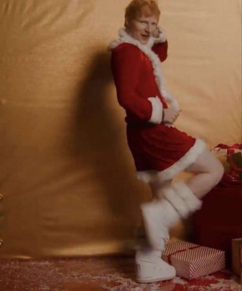 ed sheeran is posing with his leg up and his hands on his hip and head in a santa dress with white fuzzy boots on Ed Sheeran Outfit, Egg Sheeran, Floor Boards, Santa Dress, Christmas Memes, Adam Sandler, Golden Star, Greatest Songs, The A Team