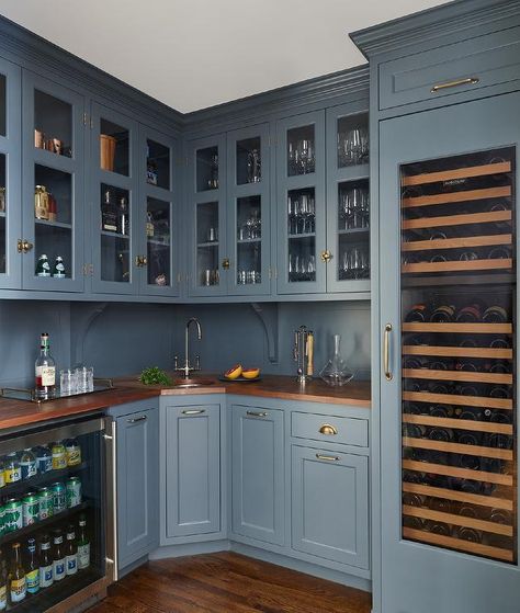 Blue wet bar and pantry cabinets with vintage aged brass hardware and walnut countertops creates a stunning design with upgraded features. Corner Wet Bar, Corner Pantry Ideas, Dark Stained Wood Floors, Grey Modern Kitchen, Walnut Countertop, Light Gray Cabinets, Corner Pantry, Hidden Kitchen, Blue Kitchen Cabinets