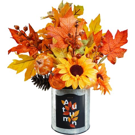 PRICES MAY VARY. Quantity: The package includes 1 Fall Harvest Floral Arrangement in Metal Planter. This fall arrangement consists of 5 autumn artificial floral picks featuring mixed maple leaves, orange velvet pumpkins, foam pumpkins, sunflowers, natural pinecones and berry clusters. They are all set inside a galvanized metal planter with reads "HELLO Autumn". This charming fall centerpiece is pretty from all sides and perfect for adding farmhouse charm to any room. Size: The overall dimensions Thanksgiving Fresh Flower Centerpieces, Mini Pumpkin Flower Arrangements, Thanksgiving Floral Centerpieces Michaels Stores, Thanksgiving Faux Flowers, Thanksgiving Centerpiece Jar With Fall Accessories, Fall Harvest Party, Fake Flower Arrangements, Pumpkin Planter, Farmhouse Centerpiece