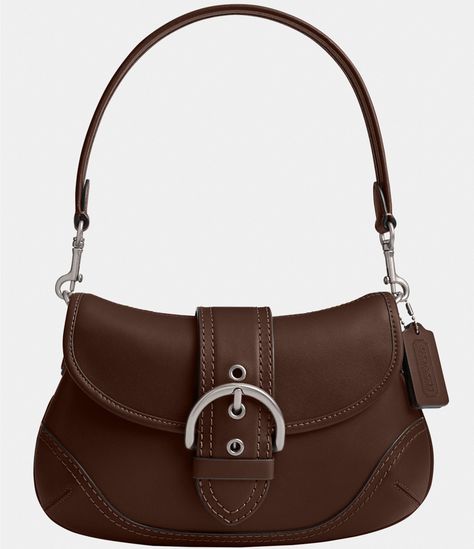 From COACH, the Glovetanned Leather Soho Shoulder Bag features:Regenerative glove-tanned leatherInside zip pocketMagnetic snap closure, fabric liningDetachable handle with an approx. 7.25" dropApprox.: 10.5" L x 6.25" x 2.75"Imported. Brown Saddle Bag, Coach Soho Bag, Winter Handbag, Winter Handbags, Tan Shoulder Bag, Miss Match, Tan Bag, Fancy Bags