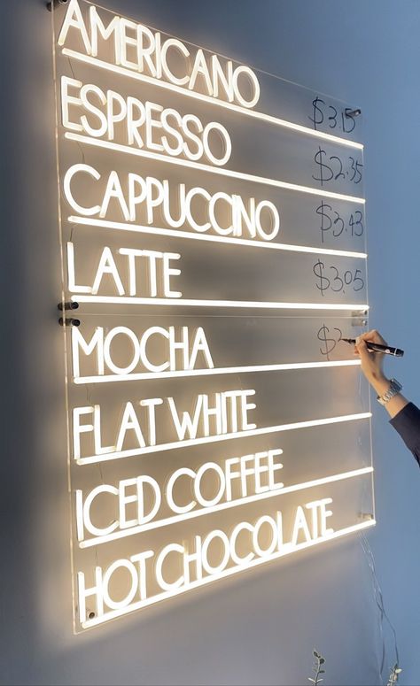 Are you a coffee lover or do you own a coffee shop? If your answer is yes, then you’ll love our coffee menu neon sign. This neon sign is designed for coffee lovers and it features 8 customer-favorite coffee drinks all lit with vibrant LED bulbs.  The coffee menu neon sign is handcrafted from transparent PVC tubes giving the neon sign ultra-durability and a lightweight frame. These features make the coffee menu neon safe to use and easy to install in coffee shops and by your coffee table at home. Cafe Table Decor Coffee Shop, Classy Restaurant Design, Coffee Shop Board Ideas, Cafe Shop Ideas, Coffee Shop Mugs, Greenhouse Coffee Shop, Boho Coffee Shop Interior Design, Coffee Shop Inspiration, Neon Signs Cafe