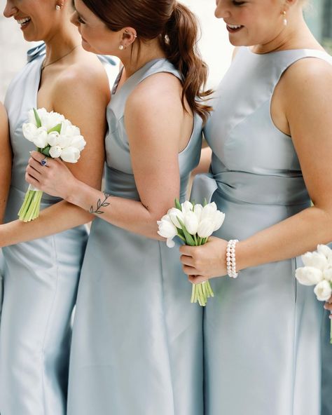 A blue and white wedding at Omni Barton Creek with dusty blue satin bridesmaids dresses, tulip bouquets, and all white flowers | Julie Wilhite Photography - Austin Wedding Photographer Light Blue Bridesmaid Bouquet, Blue And White Bridesmaid Bouquet, Bridesmaid Bouquet Blue, Tulip Bridesmaid Bouquet, White Tulip Wedding, White Bridesmaids Bouquets, Wedding Bouquets Bridesmaids, Satin Bridesmaids Dresses, Tulip Wedding Bouquet