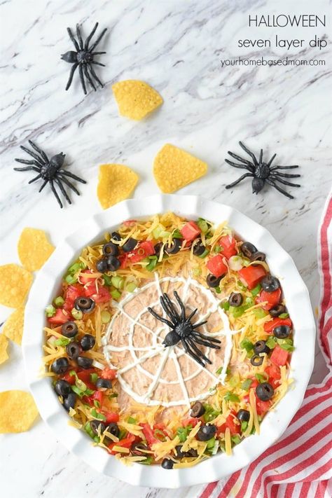 Halloween 7 Layer Dip is a fun holiday twist on a classic appetizer that is always a hit at every party.  Seven layers of spooky deliciousness! Halloween 7 Layer Dip, Layer Bean Dip, 7 Layer Bean Dip, 7 Layer Taco Dip, 7 Layer Dip Recipe, Mexican Layer Dip, Layered Dip Recipes, Layered Bean Dip, 7 Layer Dip