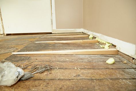 Floor Flattening - Adding Shims Wood To Laminate Floor Transition, Wood Floors Changing Direction, Raising Floor Level, Leveling Floors In Old House, How To Level A Floor In An Old House, Flip Homes, Laminate Wood Flooring Installing, Diy Laminate Flooring Install, Floor Leveling