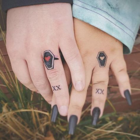 Coffin Finger Tattoo, Couple Finger Tattoo Ideas, Wedding Ring Tattoos For Couples, Ring Tattoos For Couples, Ring Finger Tattoo Couple, Wedding Ring Tattoo Ideas, Engagement Tattoos, Wedding Ring Tattoos, Finger Tattoo Ideas