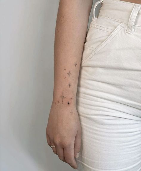 Stars On Forearm Tattoo, Stars Wrap Around Tattoo, Star Arm Wrap Tattoo, Star Tattoos For Women On Wrist, Wrist Stars Tattoo, Constellation Arm Tattoo, Starry Hand Tattoo, Wrap Around Star Tattoo, Spine Tattoos Stars