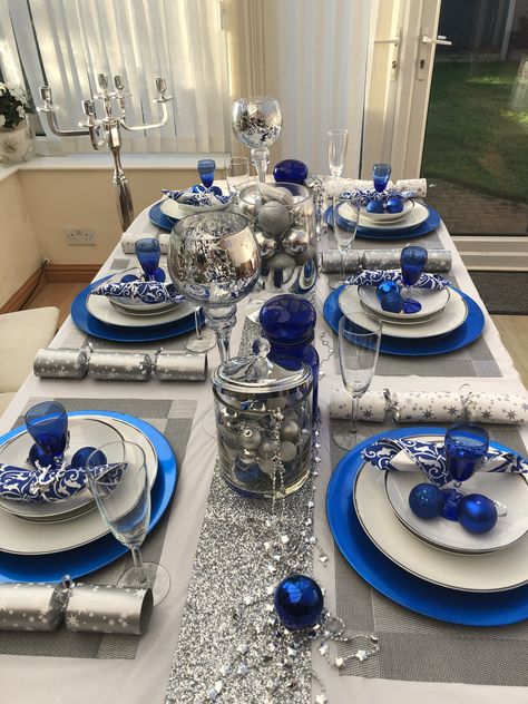 Navy And White Tablescape, Blue And White Xmas Table Decor, Blue Sliver White Christmas Decor Diy, Blue And White Xmas Decor, Blue Christmas Dining Table Decor, Silver And Blue Christmas Table, Winter Wedding Church Decorations, Blue Silver And White Christmas Decor, Blue Christmas Party Theme