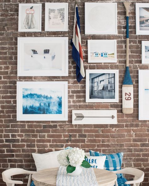 how-to-hang-a-gallery-wall-on-exposed-brick-walls-1 Stairway Wall Decor, Pictures On Wall, Old Fashioned Christmas Decorations, Diy Large Wall Art, Large Scale Wall Art, Hang Pictures, Foyer Decorating, Exposed Brick Walls, How To Hang