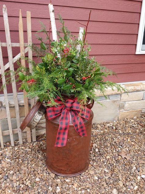 Antique Milk Can from the Buffalo Nickel Antique Barn in Minnesota. Filled with Birch, Cedar, Holly and Boxwood with a Buffalo Plaid Bow. Christmas Milk Can, Antique Milk Can, Porch Pots, Winter Decorating, Buffalo Nickel, Milk Cans, Xmas Ideas, Plaid Bow, The Buffalo