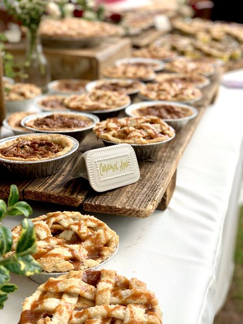 Loved that this couple chose to use homemade pies for all of their desserts for their wedding! Featured are handmade lattice mini wedding apple pies with homemade caramel drizzle 🤤 #caramelapple #caramel #caramelapplepie #pies #apple #handmade #wedding #love #homemade #diy Mini Pie Table Wedding, Mini Pie Bar Wedding, Apple Pie Wedding Cake, Diy Mini Apple Pies, Mini Pies Wedding Display, Mini Pie Wedding Display, Mini Pie Display, Mini Pie Wedding, Mini Pies For Wedding